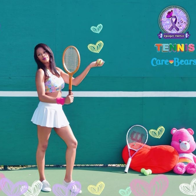 Rachel on a tennis court with Care-Bears