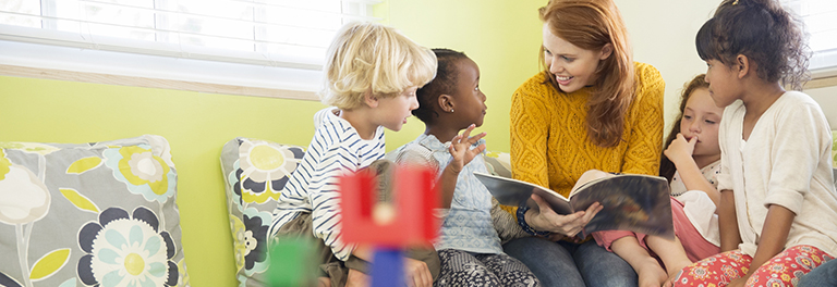 Woman reading to children